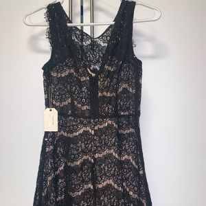 Knee length black lace dress
